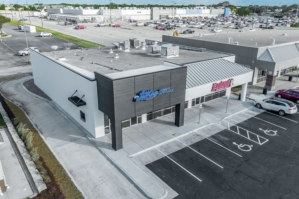 Aerial photo of a recently remodeled building with a drive-thru