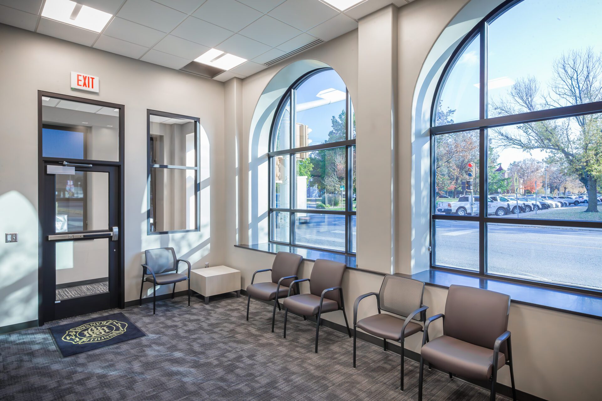 An entryway with large windows bringing in natural light.